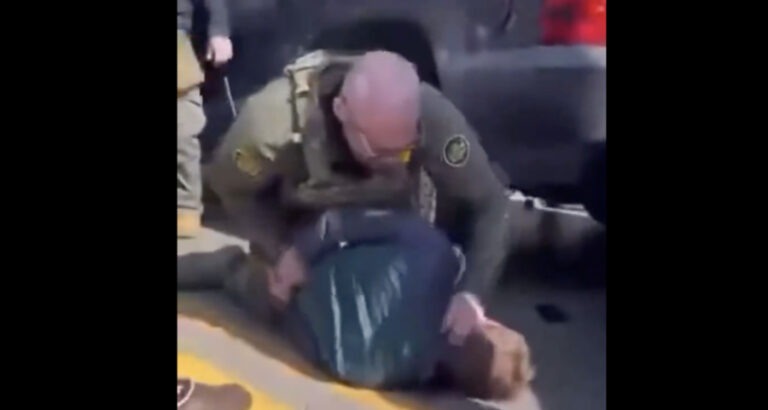 ICE Agent Filmed Brutally Beating Man, Pushing His Face Into Pavement, Aiming Gun at Bystanders